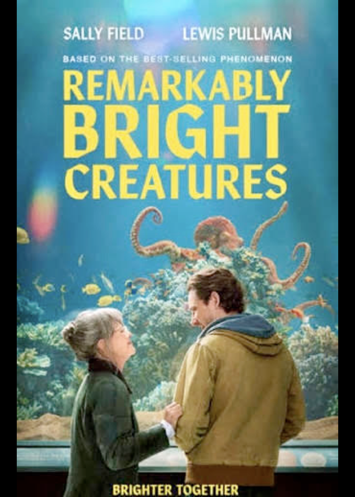 Film poster for Remarkably Bright Creatures. Sally Field and Lewis Pullman standing in front of an octopus aquarium. Based on the Best selling phenomenon. Brighter Together.