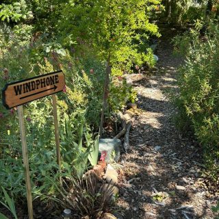 Worden sign directing people to the Wind Phone in Peace Forest of the Garden
