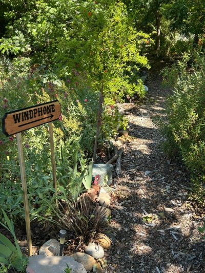 Worden sign directing people to the Wind Phone in Peace Forest of the Garden